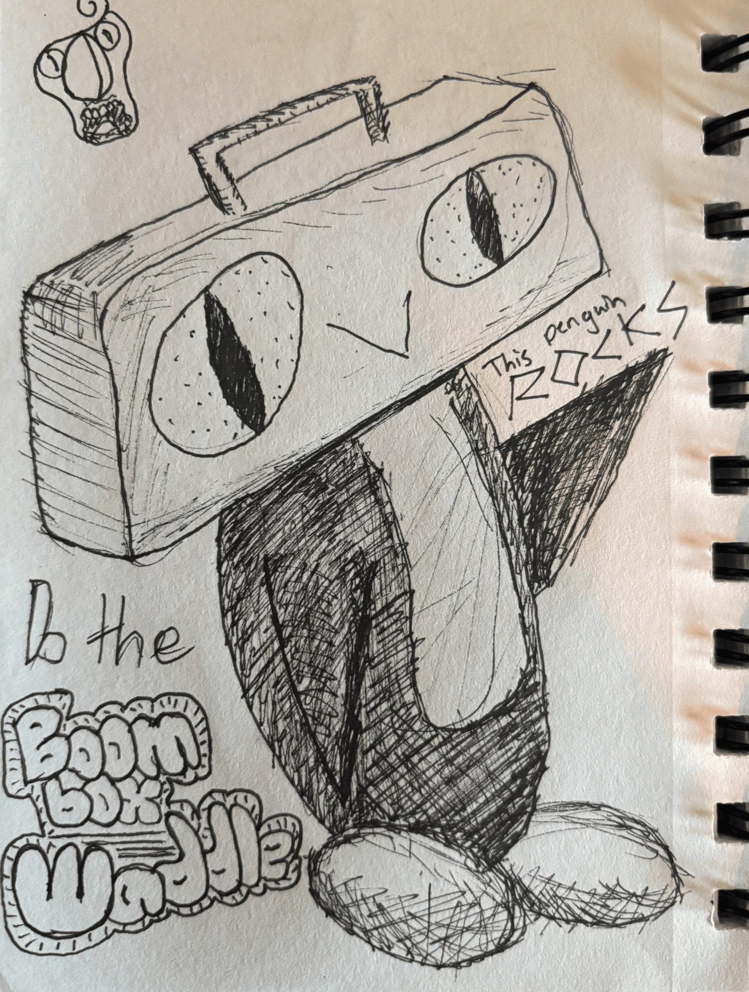 A pen sketch on a sketchbook page of Boom Box Waddle, a penguin whose head is a boom box with two big eyes, beside the hand-lettered words "Do the Boom Box Waddle" and "This penguin ROCKS"
